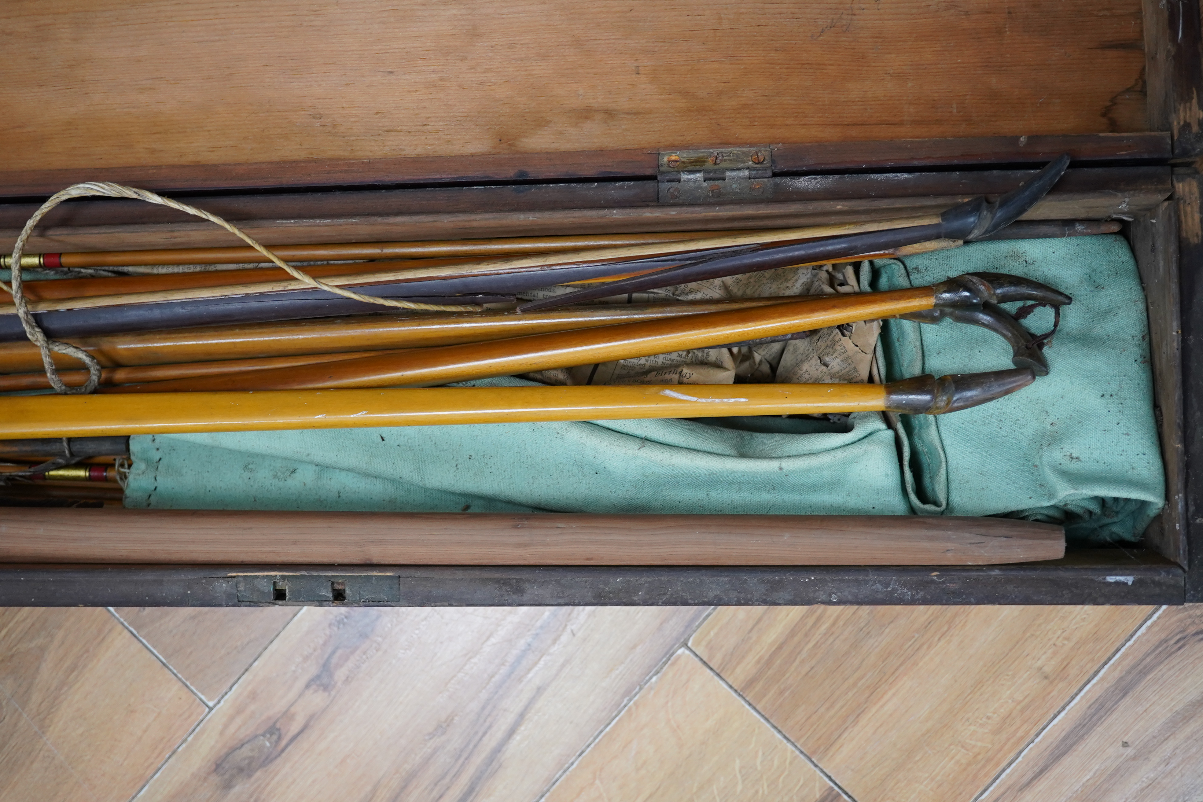 Five Victorian and later archery longbows, a blank for a longbow, and a selection of arrows, boxed. Condition - poor to good.